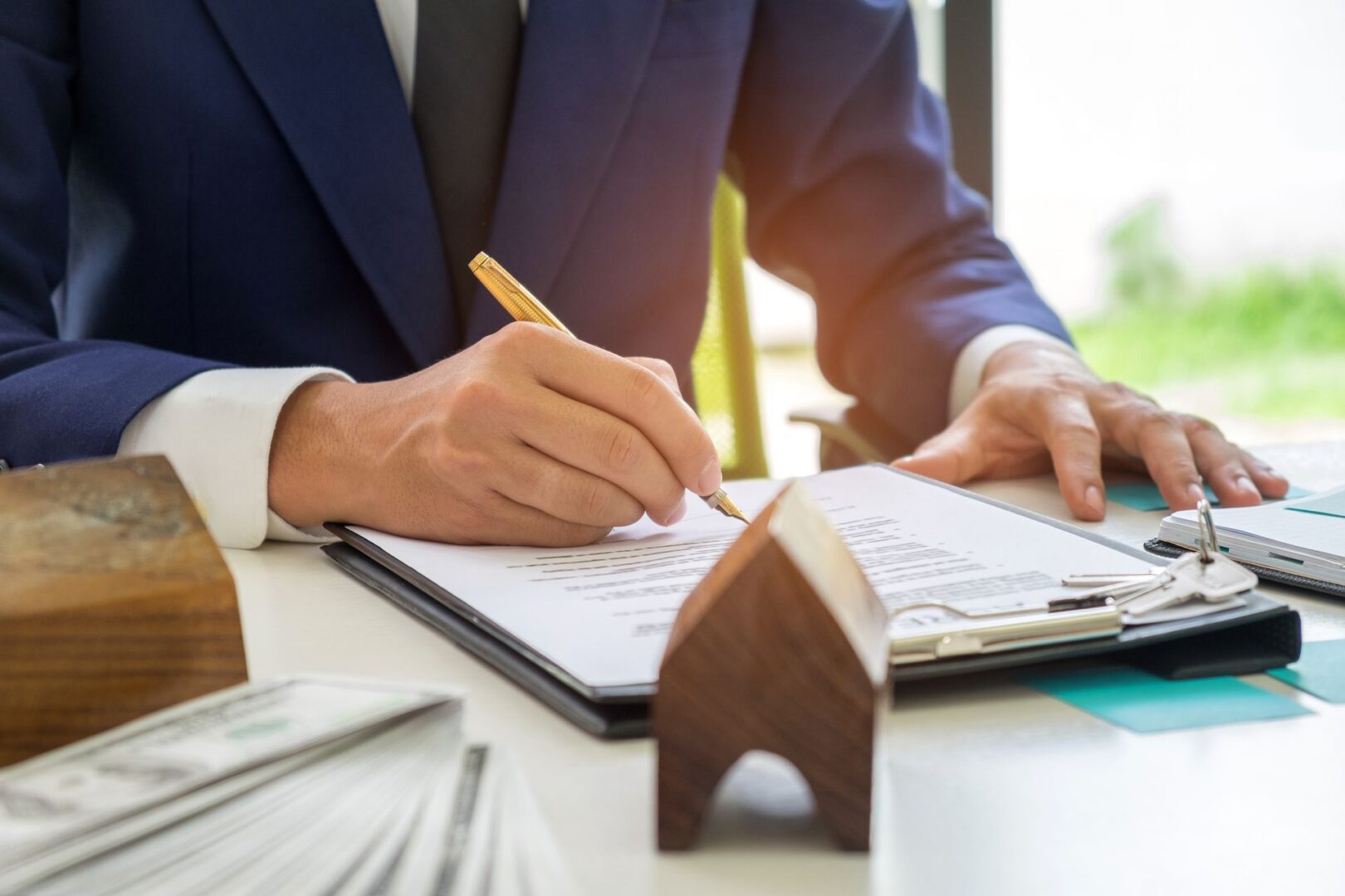 Businessman signing documents at desk