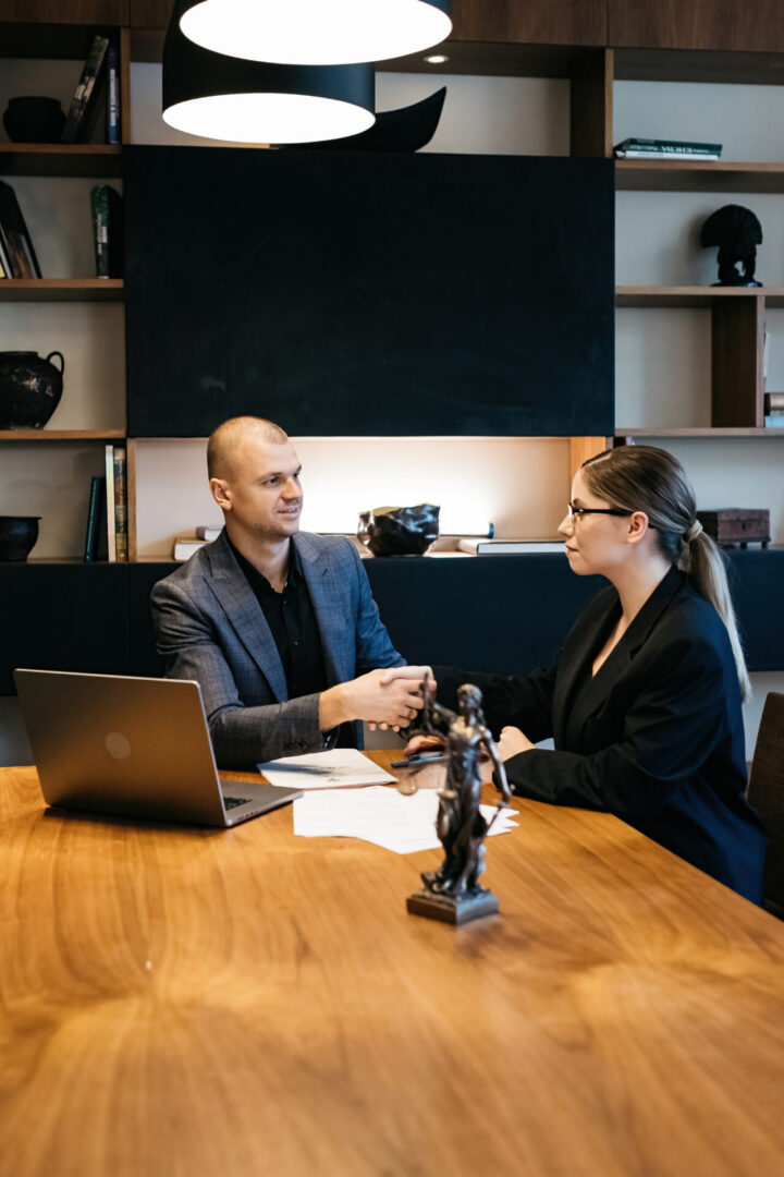 Professional discussion around wooden table
