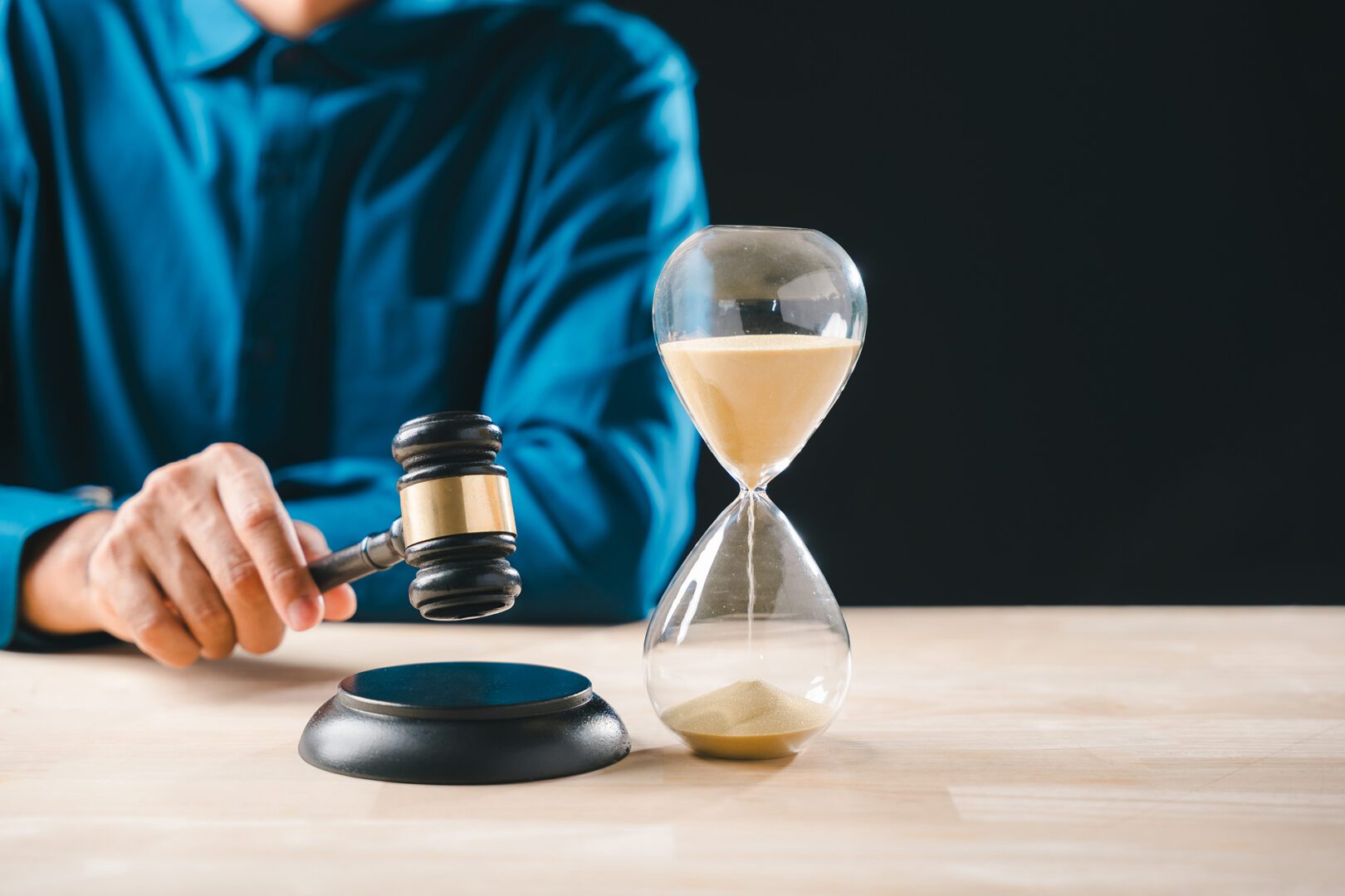 Judge with gavel and hourglass
