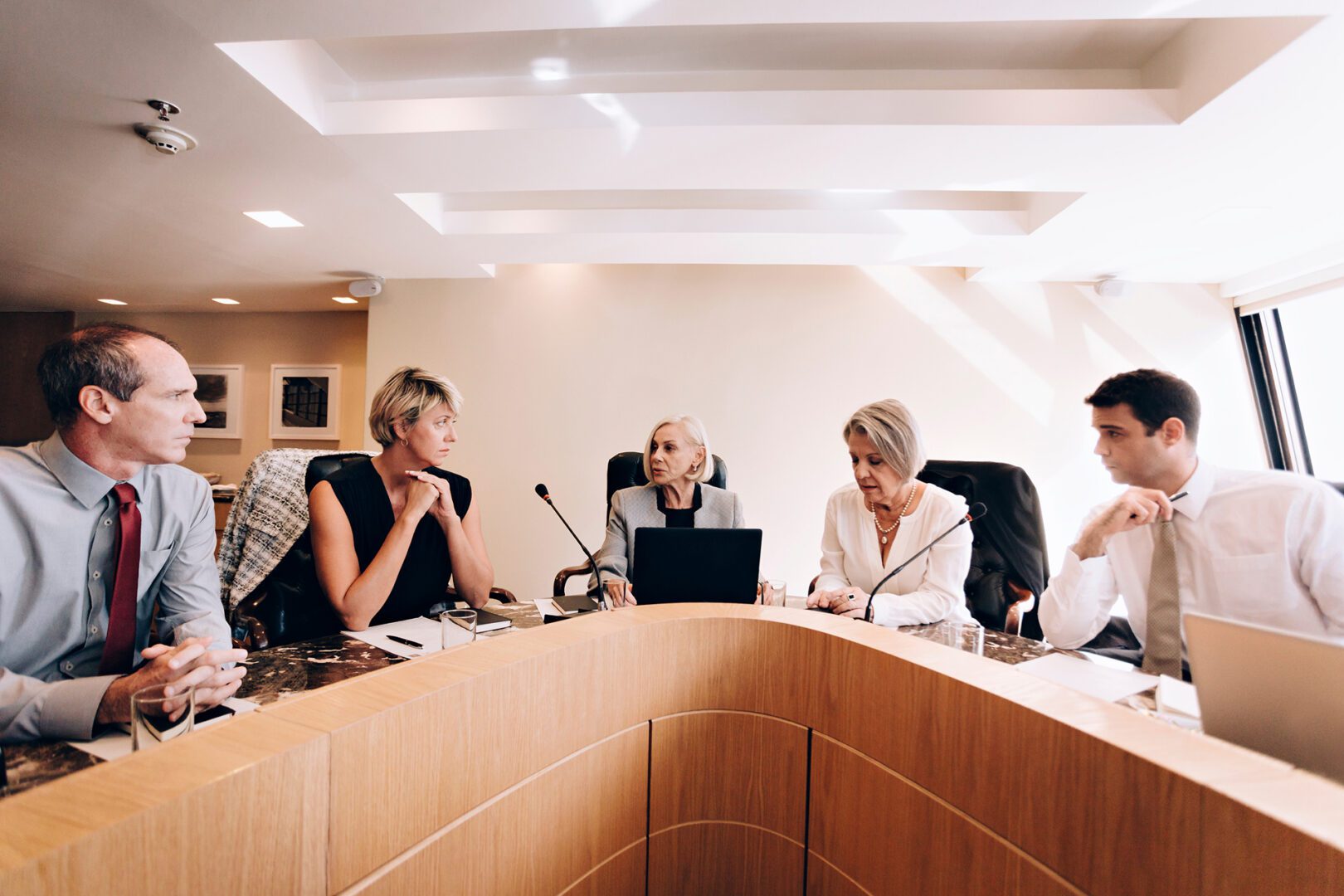 Professionals discussing at a boardroom table