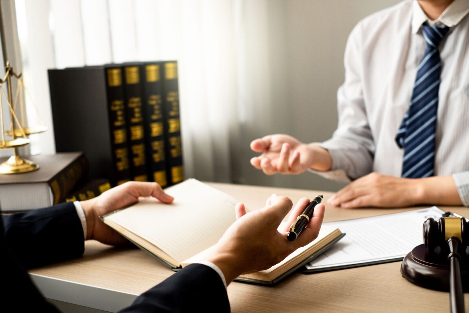 Office discussion with book and paperwork