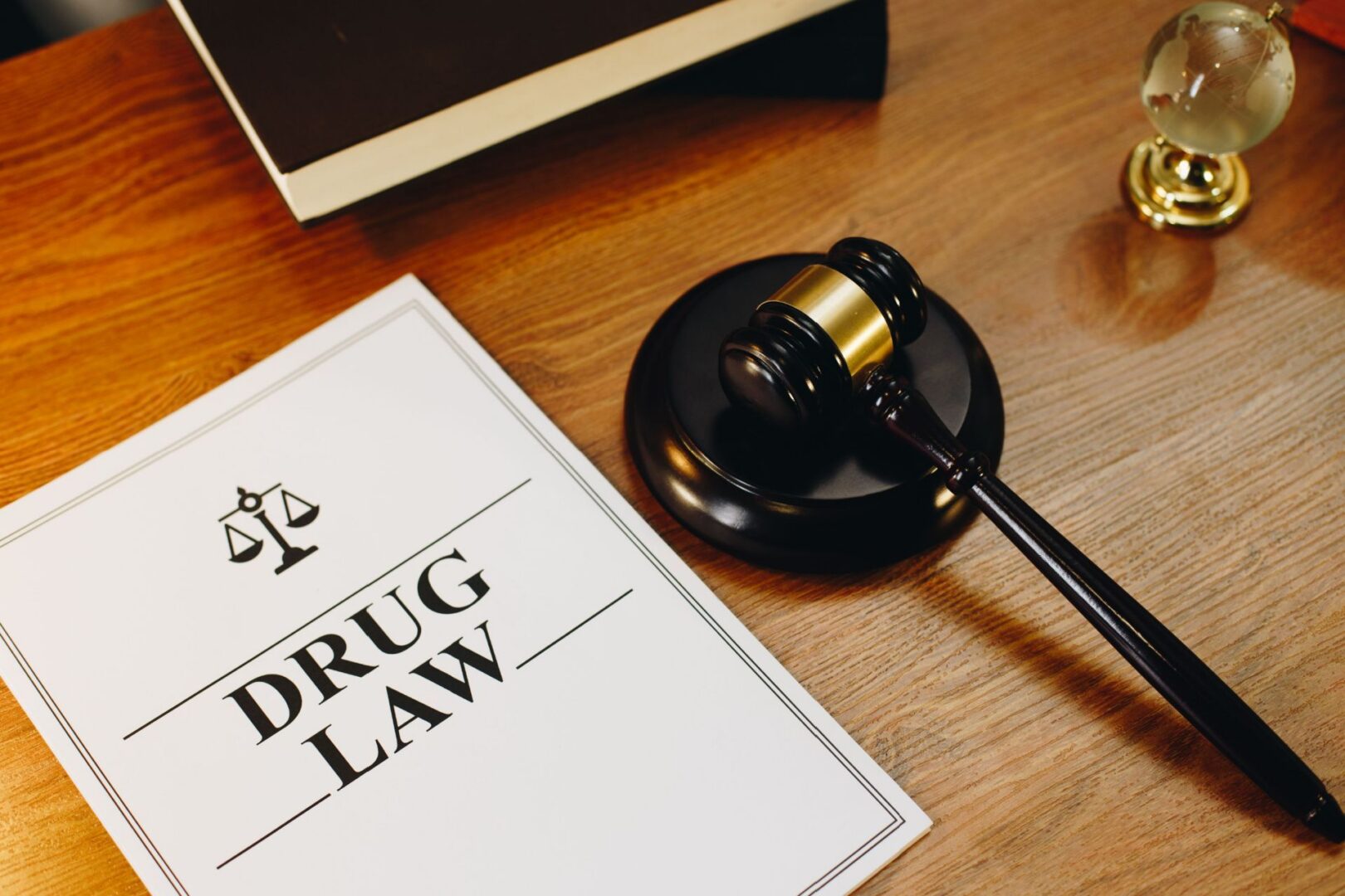 Drug law document and gavel on desk.