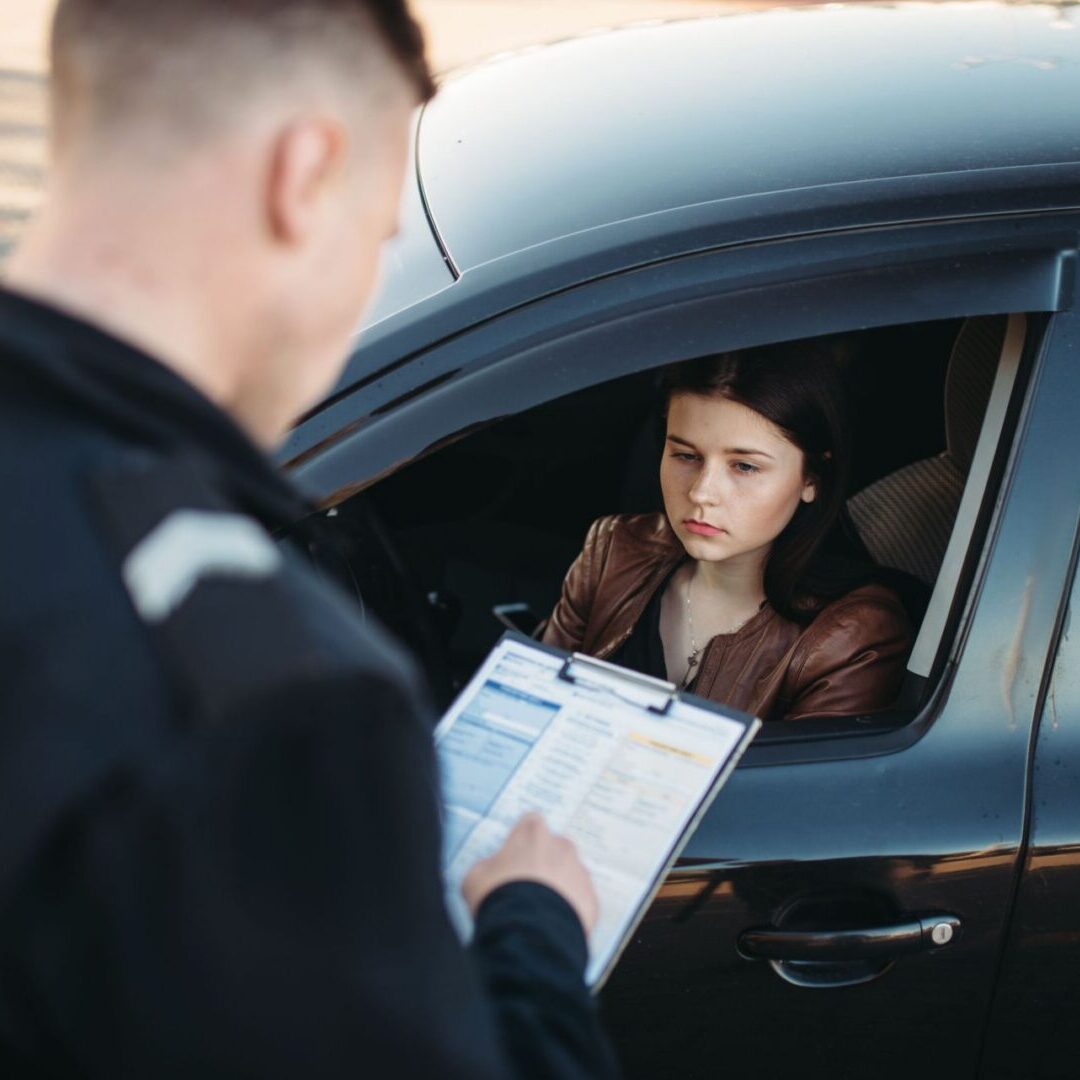 Police officer talking to a driver